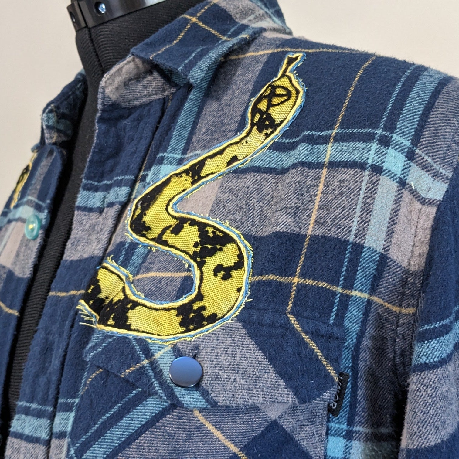 Navy button-up flannel with snakes and antique buttons