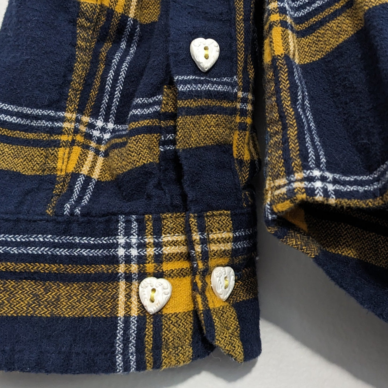 Navy flannel with white floral and antique heart buttons